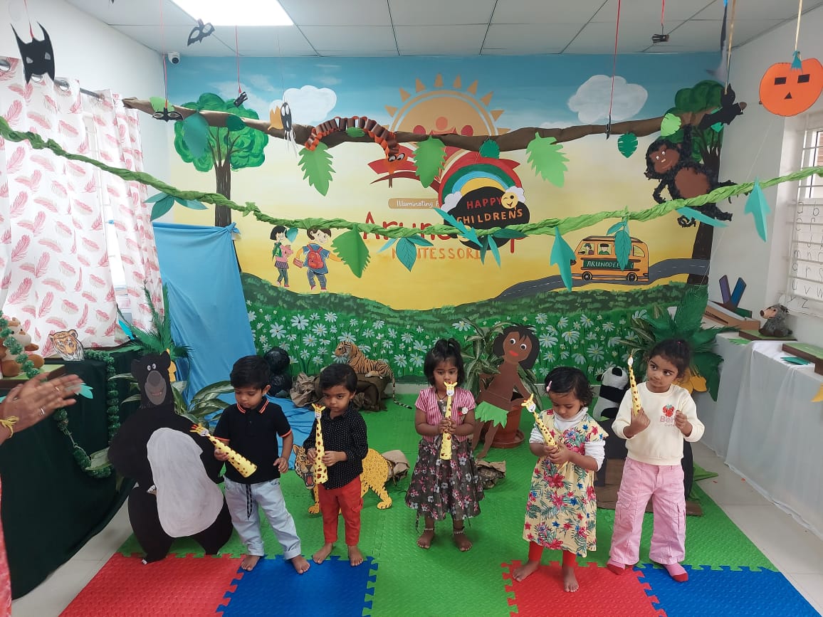 Children in a jungle-themed classroom celebrating Children's Day